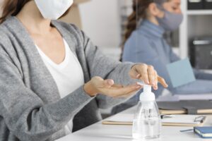 close up woman using disinfectant