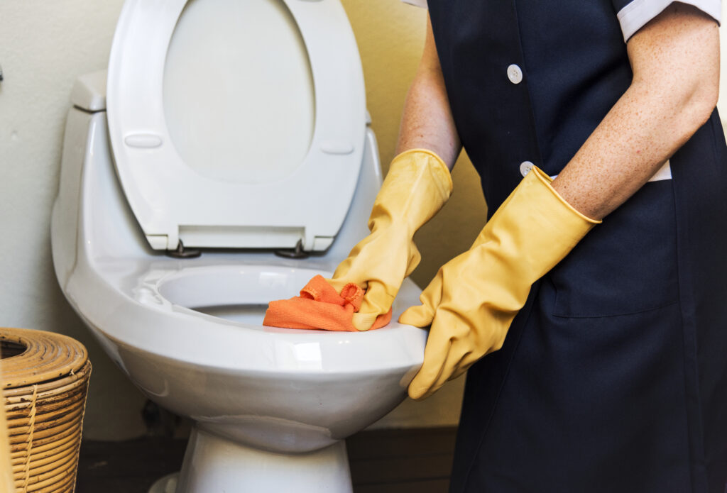 Housekeeper cleaning a hotel room